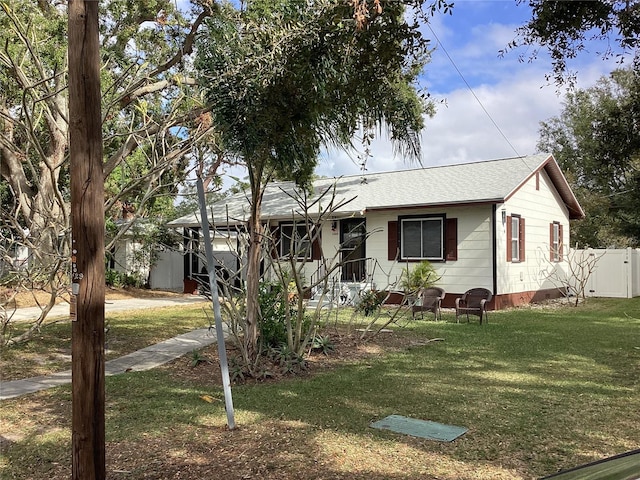 view of front of property with a front lawn