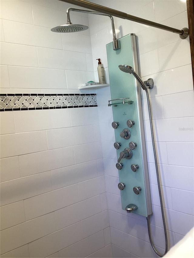 bathroom with a tile shower