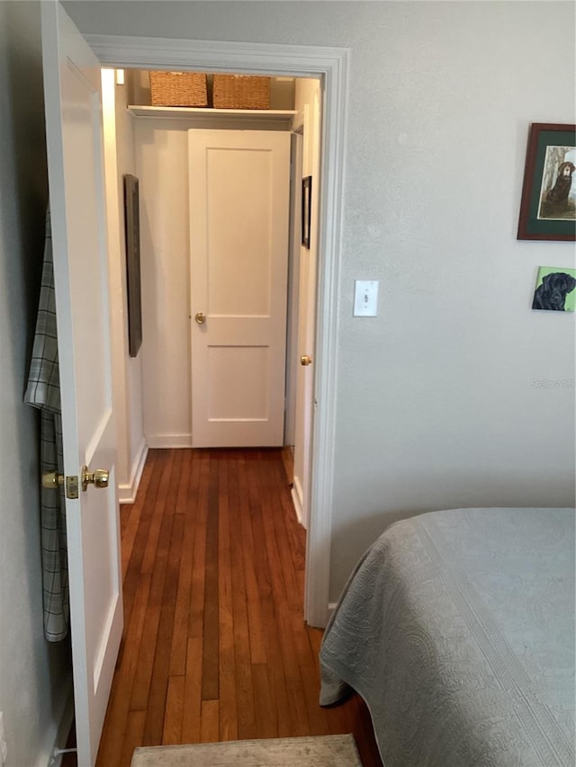 bedroom featuring a closet and dark hardwood / wood-style floors