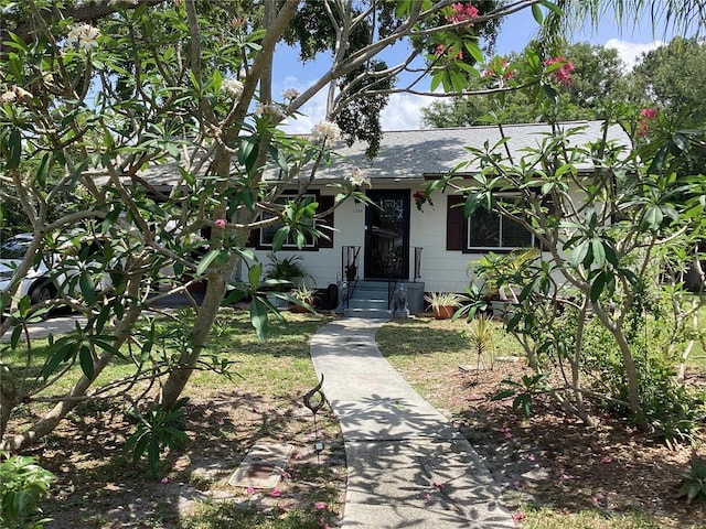 1529 Paloma Ln, Dunedin, FL 34698 - view of front of property with a shingled roof
