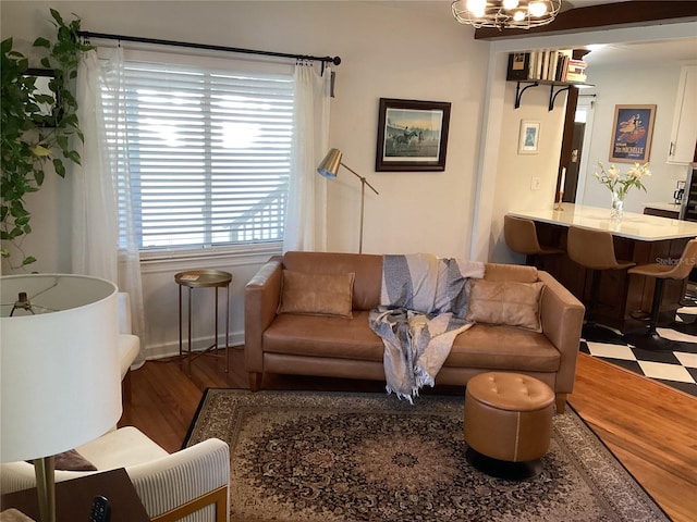 1529 Paloma Ln, Dunedin, FL 34698 - living room featuring wood finished floors and a chandelier