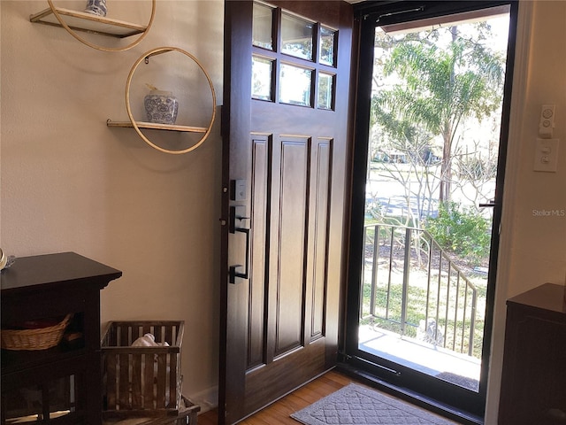1529 Paloma Ln, Dunedin, FL 34698 - entrance foyer with wood finished floors and healthy amount of natural light