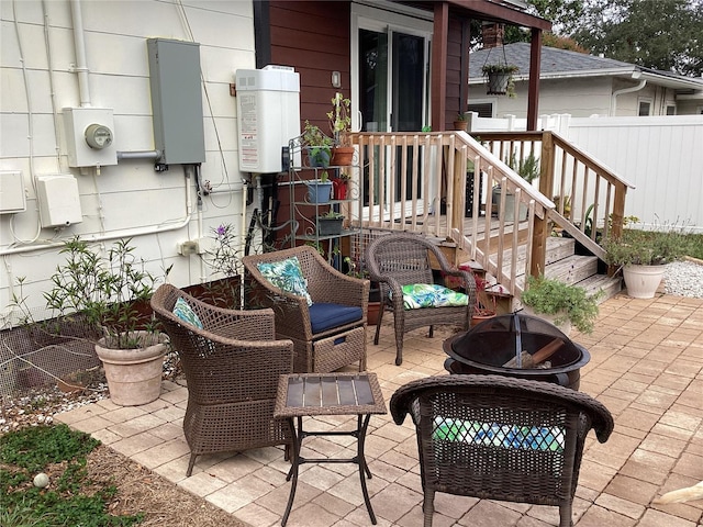 1529 Paloma Ln, Dunedin, FL 34698 - view of patio with a fire pit and fence