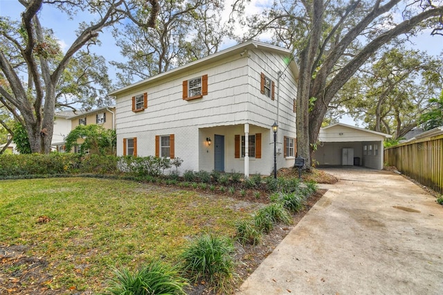 view of front facade featuring a carport and a front lawn