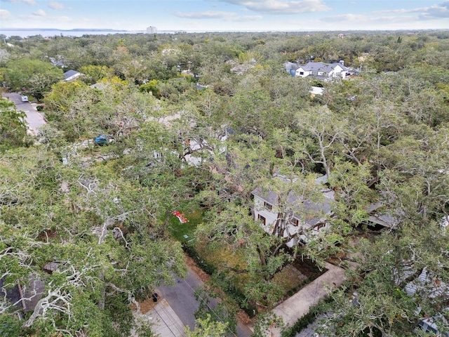 drone / aerial view featuring a view of trees