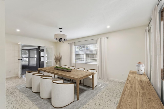 dining area with recessed lighting, a notable chandelier, and baseboards