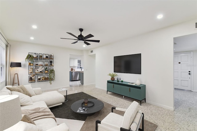 living room featuring light speckled floor, recessed lighting, visible vents, a ceiling fan, and baseboards