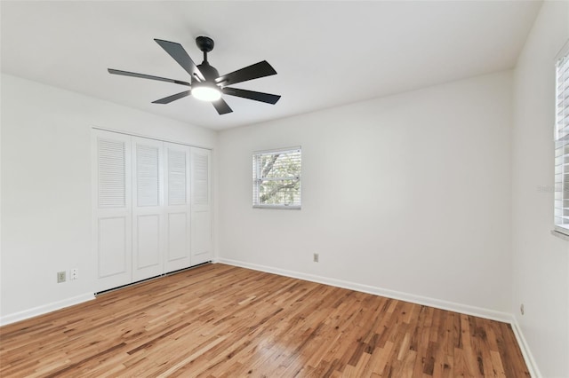 unfurnished bedroom featuring light wood finished floors and baseboards