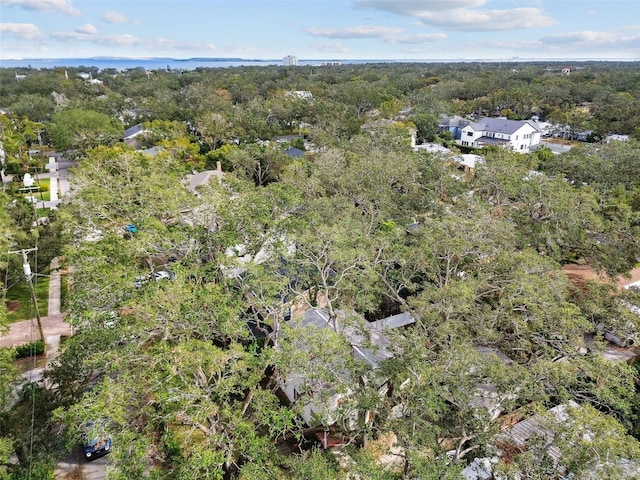 drone / aerial view featuring a view of trees