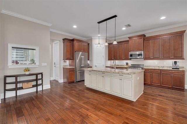 kitchen with a kitchen island with sink, crown molding, dark wood-type flooring, and appliances with stainless steel finishes