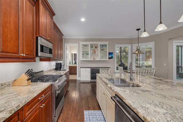 kitchen featuring dark hardwood / wood-style flooring, stainless steel appliances, sink, white cabinetry, and wine cooler