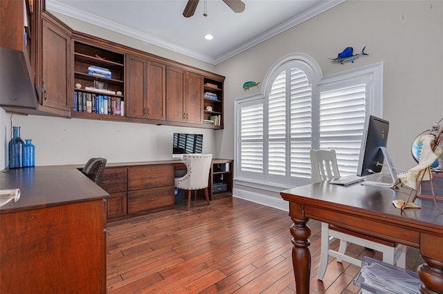 office space featuring dark hardwood / wood-style floors, ceiling fan, and ornamental molding