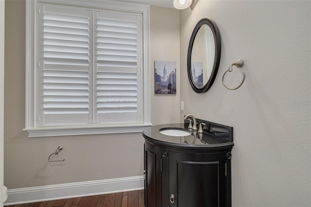 bathroom featuring hardwood / wood-style floors and vanity