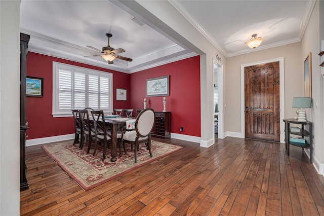 dining space with ceiling fan, ornamental molding, and dark wood-type flooring