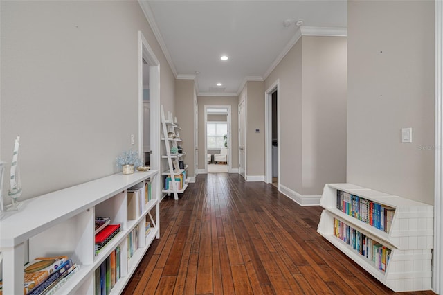 hallway with dark hardwood / wood-style floors and ornamental molding