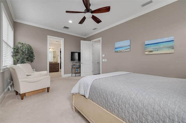 bedroom with connected bathroom, light colored carpet, ceiling fan, and crown molding