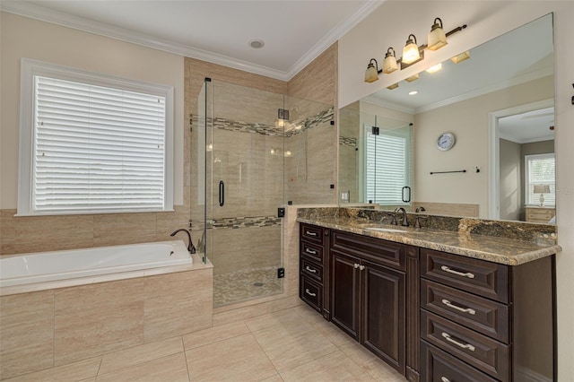 bathroom featuring a wealth of natural light, vanity, shower with separate bathtub, and ornamental molding