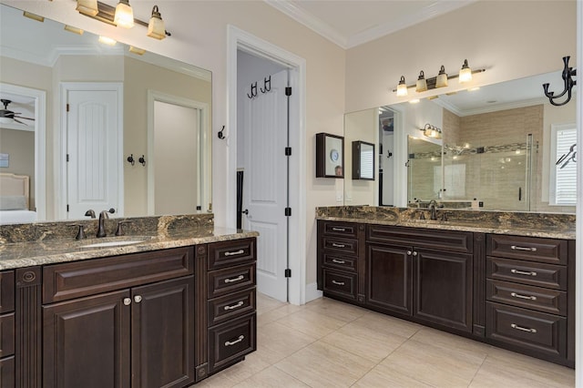 bathroom with walk in shower, ceiling fan, vanity, and ornamental molding