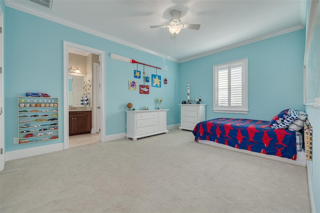 carpeted bedroom featuring ensuite bathroom, ceiling fan, and ornamental molding