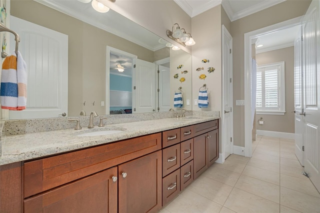 bathroom featuring crown molding, tile patterned flooring, and vanity