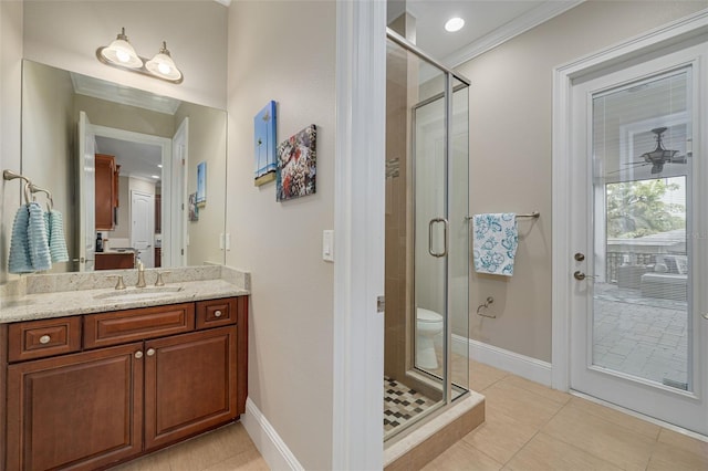 bathroom featuring tile patterned floors, crown molding, vanity, and walk in shower