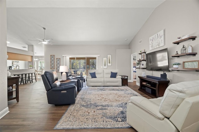 living room with sink, vaulted ceiling, ceiling fan, and dark wood-type flooring