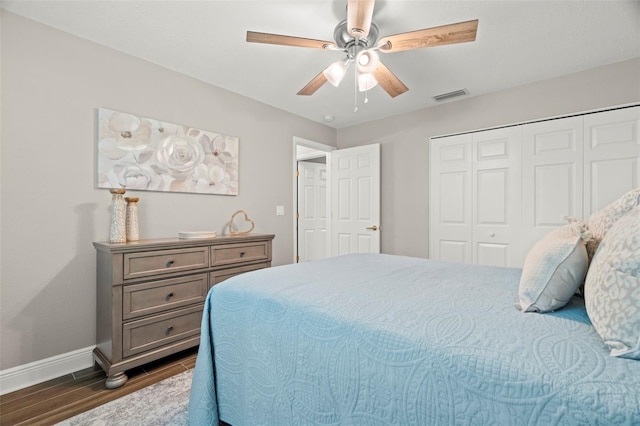 bedroom featuring a closet, ceiling fan, and dark wood-type flooring