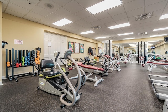 gym featuring a paneled ceiling