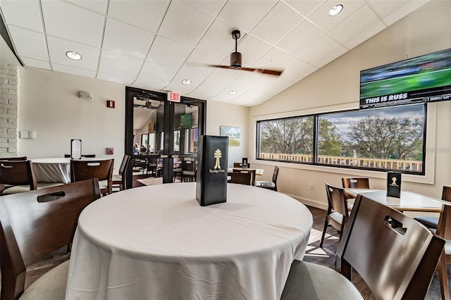 dining area featuring hardwood / wood-style floors and a drop ceiling