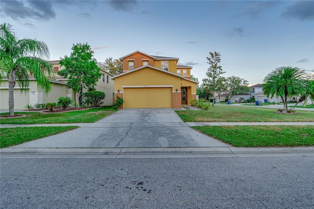 view of front facade with a front yard and a garage