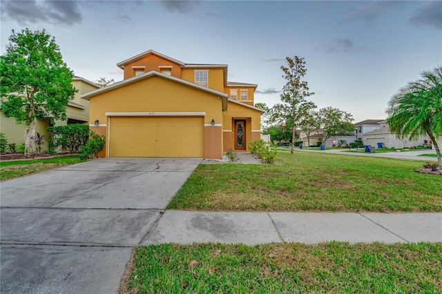 view of front of house featuring a garage and a front yard