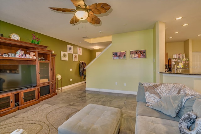 living room featuring ceiling fan