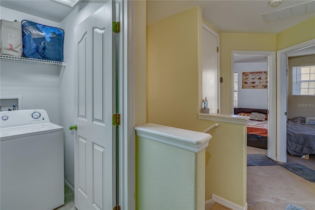 laundry room with light carpet and washer / clothes dryer