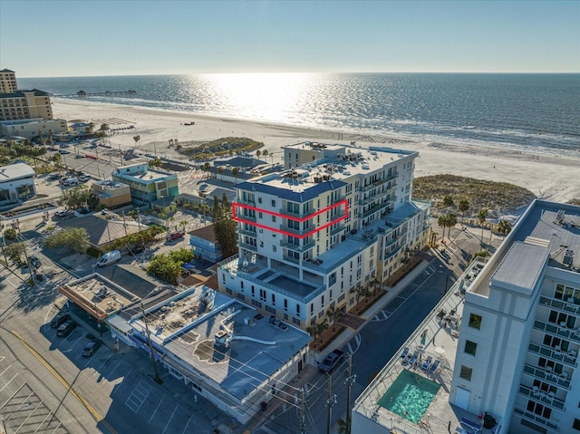 bird's eye view featuring a beach view and a water view