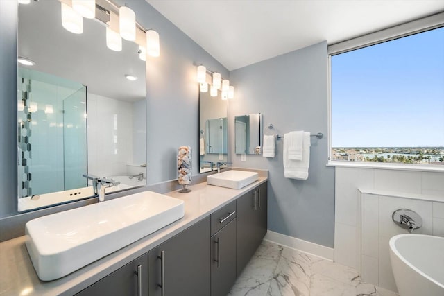 bathroom featuring vanity, a healthy amount of sunlight, and plus walk in shower