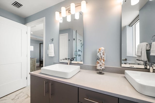 bathroom with vanity and an enclosed shower