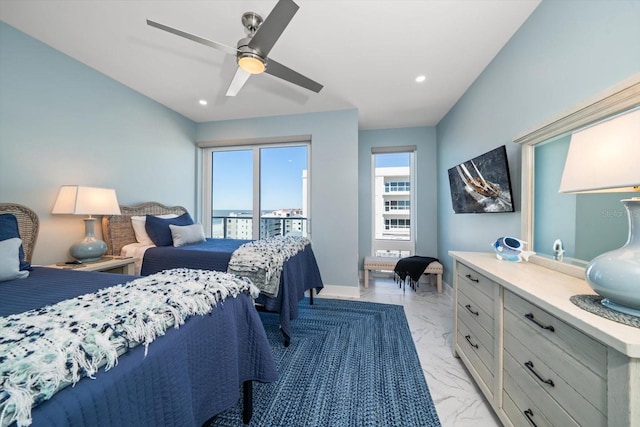 bedroom with ceiling fan and access to exterior