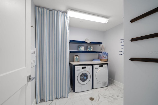 laundry area with independent washer and dryer