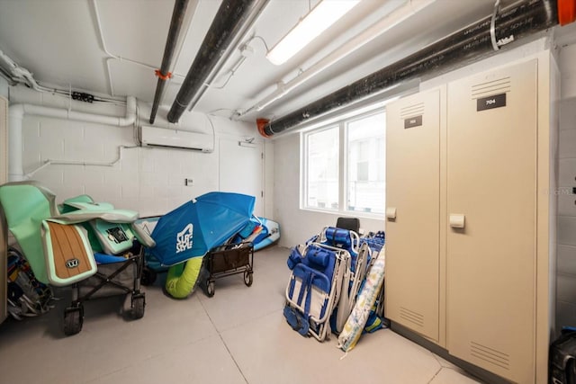 basement with a wall mounted air conditioner