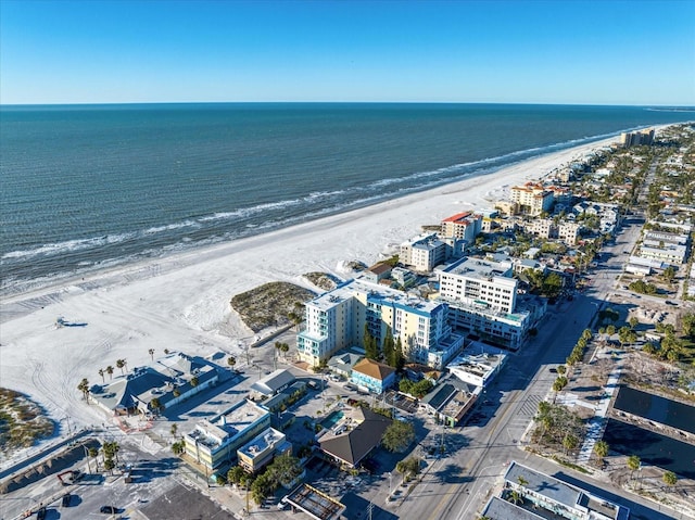 birds eye view of property featuring a view of the beach and a water view