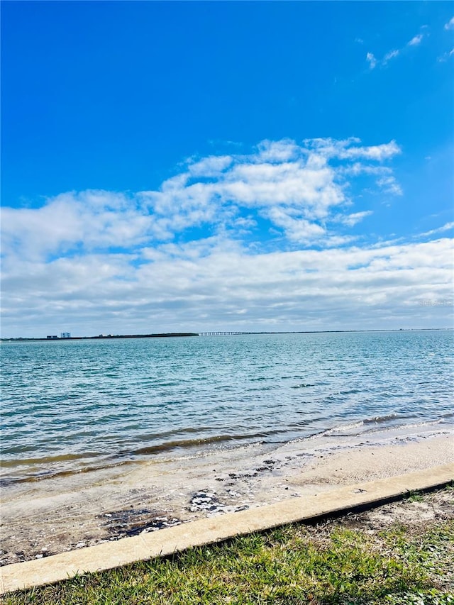 property view of water featuring a beach view