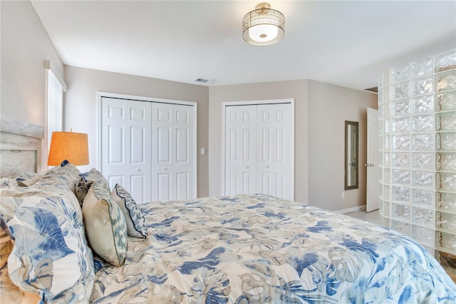 bedroom featuring multiple closets