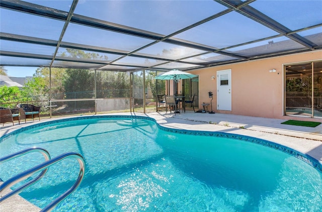 view of pool featuring a lanai and a patio