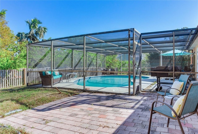 view of pool featuring a lanai and a patio area