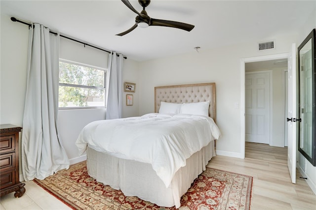 bedroom with light wood-type flooring and ceiling fan