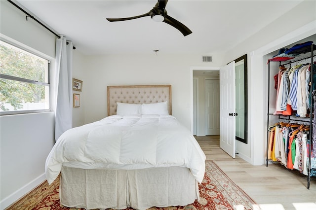 bedroom featuring ceiling fan and light hardwood / wood-style floors