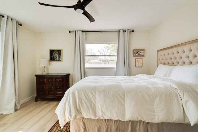 bedroom featuring ceiling fan and light hardwood / wood-style floors