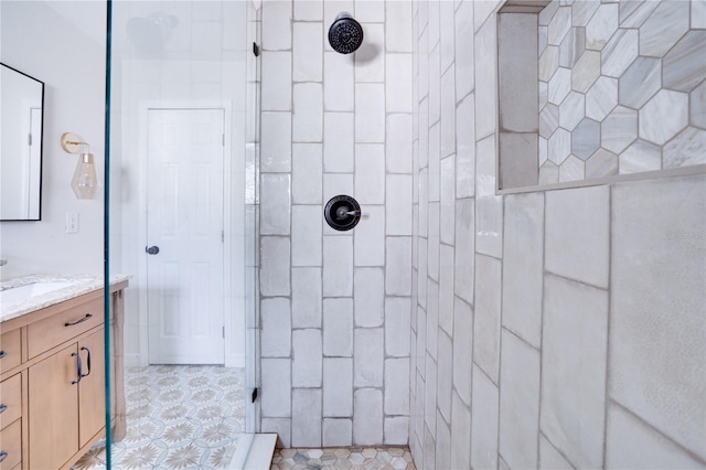 bathroom featuring vanity and a tile shower