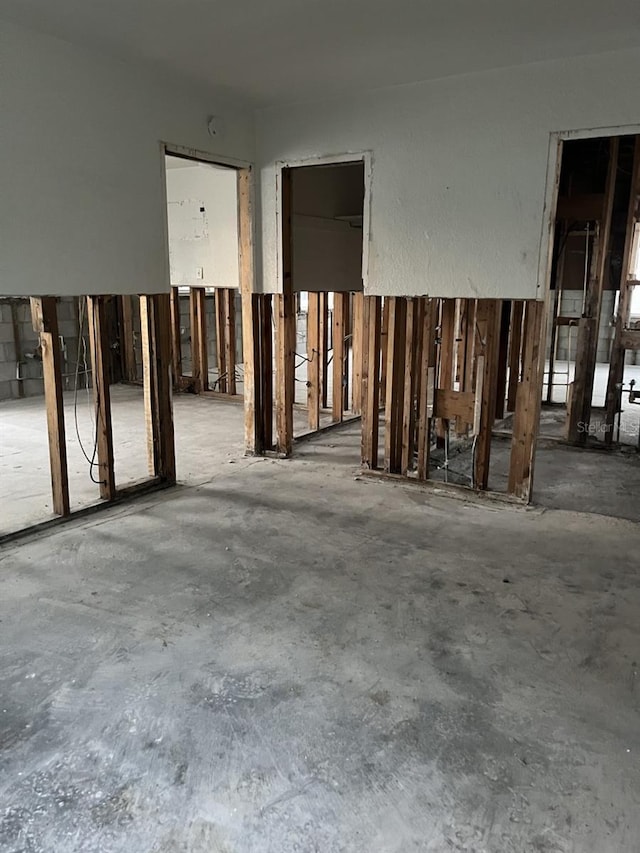 misc room with concrete flooring