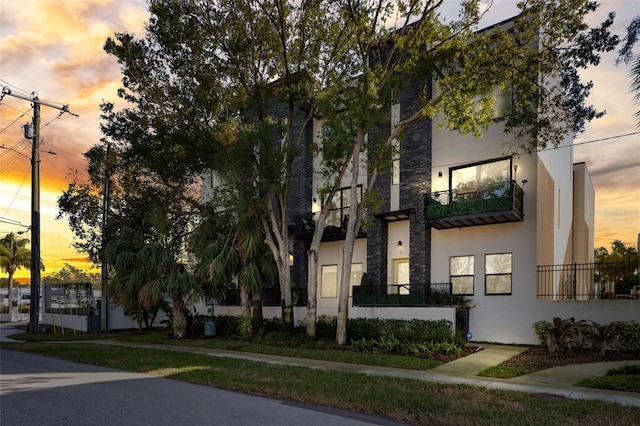 view of outdoor building at dusk